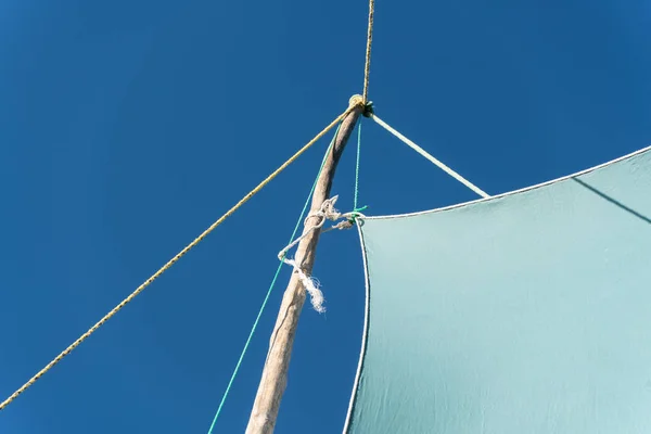 Detail on pirogue - small boat used in Madagascar - mainsail jib blea sky in background — Stock Photo, Image