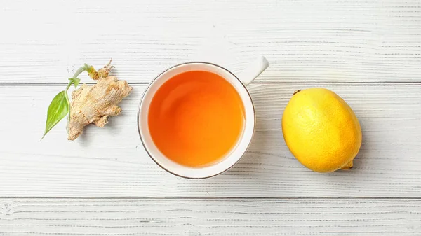 Table top view, cup of freshly brewed tea, lemon, and dry ginger — Stock Photo, Image