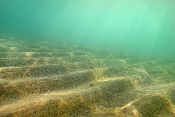 Underwater photo, small sand "dunes" shot diagonally so in this — Stock Photo, Image