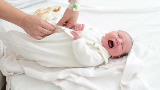 Nursing Mother Dressing Her Newborn Crying Baby Maternity — Stock Video