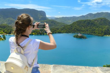 Tourist Enjoing View of Lake Bled clipart