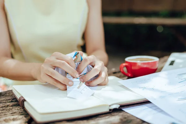 A businesswomen Crumpled up papers by hand. Fail, bad, no idea concept.