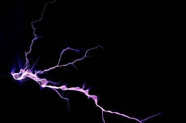 Tesla Coil, Electrostatic Discharge, spark, lightning on black background  clipart