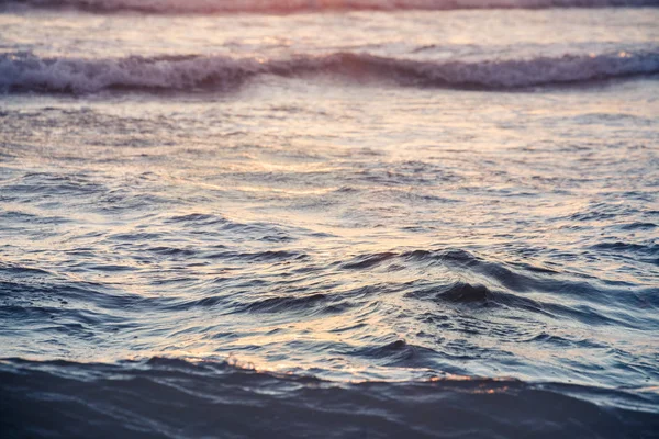 Small sea waves in sunrise on a Mallorca beach — Stock Photo, Image