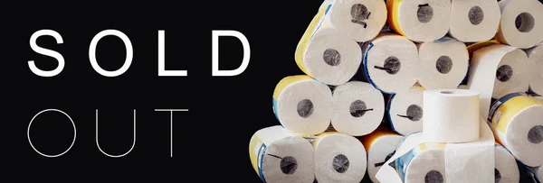 Sold Out header for webseite, banner, horizontal poster, background. A large stack of white paper rolls packages. World wide toilet paper crisis related to the outbreak of the COVID-19 coronavirus.