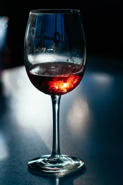 A glass of wine on dark background — Stock Photo, Image