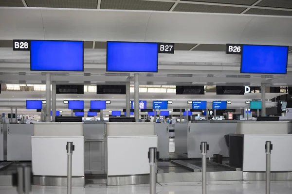 Blue screen monitor at airport ticket counter. Out of service.