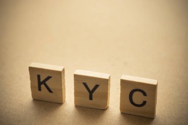 KYC on wood. Know Your Customer concept clipart