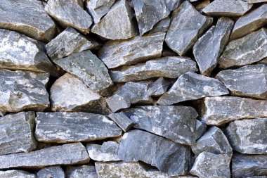 Doğal taş duvar arka plan ve doku için yığılmış