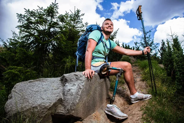 Positive Young Man Prosthesis Enjoying Nordic Walking While Having Rest — Stock Photo, Image