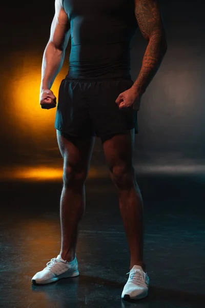 Muscular Tattooed Man Shorts White Training Shoes Standing Alone Orange — Stock Photo, Image