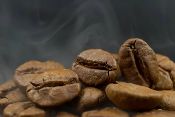 Roasted coffee beans steaming — Stock Photo, Image