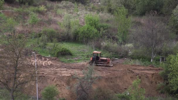 Zeitraffer: Planierraupe macht Fläche auf weiterer Baustelle platt — Stockvideo