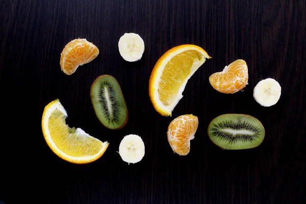 slices of fruit on a dark background.