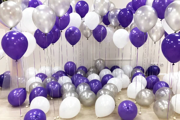 Photo studio, decorated with helium balloons of white, silver and purple. Beautiful, creative and original