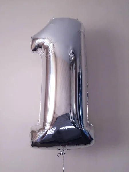 Number 1 - helium balloons of silver color. Congratulations on the anniversary