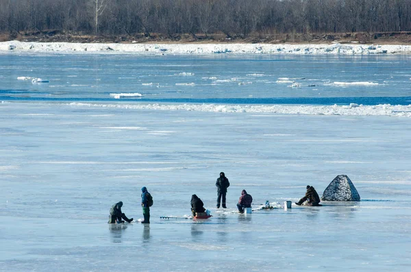 River flood fishermen. Torn river ice fishermen. River with the last ice fishermen on the ice. Russia Tatarstan Kama river in early spring