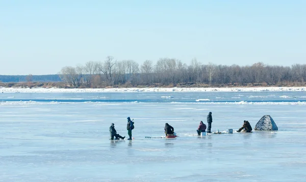 River flood fishermen. Torn river ice fishermen. River with the last ice fishermen on the ice. Russia Tatarstan Kama river in early spring