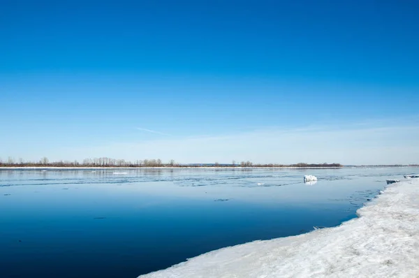 River With Broken Ice.   ice hummocks on the river in spring. landscape close-up ice drift on the river in the spring on a sunny day