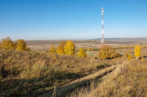 Autumn Landscape, Telephone Relay Tower. engaged in a task or activity for a fixed period of time and then replaced by a similar group. Telecommunication tower with antenna of advance Autumn
