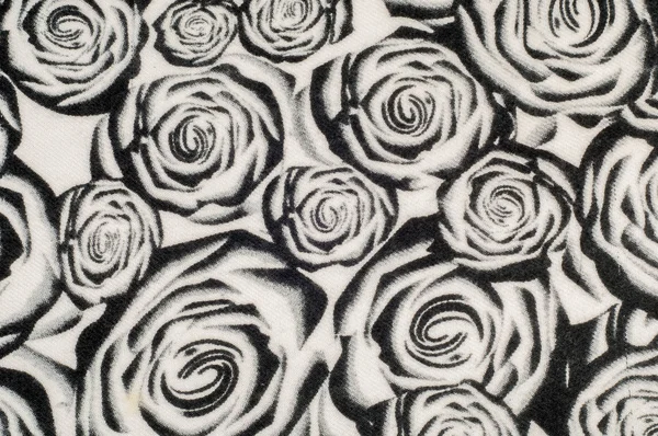 Texture, background, pattern. A woolen scarf, black and white, roses are drawn on a scarf. Woolen black and white fabric.100% pure virgin wool & authenticity labels black white houndstooth