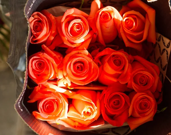 A portrait of flowers roses in a bouquet. Bouquet of roses, different colors, top view, portrait image.