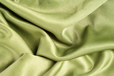 Doku, arka plan. Şablon. Kumaş ipek yeşil, krep de Chine. İpek veya benzer fiber iyi bir krep.