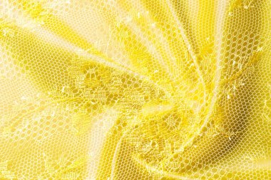 Arka plan doku, desen. Dantel sarı kumaştır.