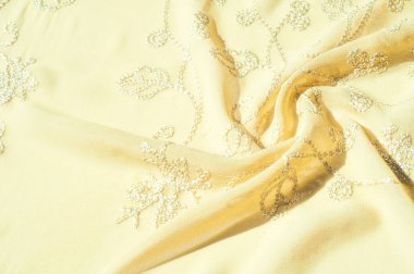 Doku, arka plan, desen. Kadın renk şal. Altın Başak. Limon kremalı. Navajo beyazdır. Eski altın. ipek kumaş.