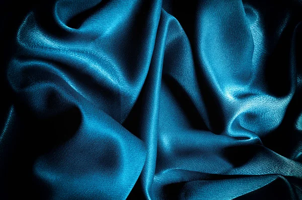 Doku, arka plan. şablon. İpek kumaş mavisi, mavi ipek kumaş ve avludaki döşeme kumaşı - koyu perdeler - sırt ve yastıklar için katı kumaşlar