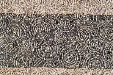 Doku, kumaş, arka plan. Altın iplik iplik ile bir daire desenli dantel kumaş
