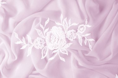 Doku, arka plan, desen. Dantelli beyaz kumaş. Çiçek dantel kumaştan yapılmış. Pembe ipek kumaş. tebrik kartı. Masaüstü duvar kağıdı. Tasarımcı için ekran koruyucu zemin