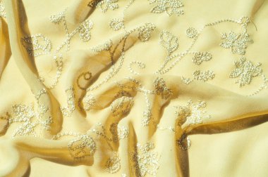 Doku, arka plan, desen. Kadın renk şal. Altın Başak. Limon kremalı. Navajo beyazdır. Eski altın. ipek kumaş.