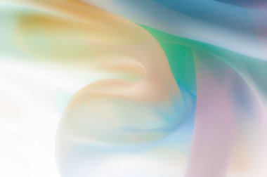 Bulanık, değil keskin netlik. Doku, arka plan, desen. İpek kumaş şeffaf, sarı-pembe yeşil mavi olduğunu. Soyut yumuşak şifon doku arka plan. 