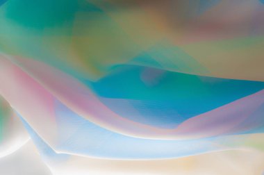 Bulanık, değil keskin netlik doku, arka plan, desen. İpek kumaş şeffaf, sarı-pembe yeşil mavi olduğunu. Soyut yumuşak şifon doku arka plan. 