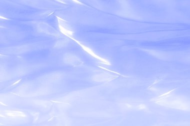 kumaş, arka plan doku. İpek mavi, bez. Zarif ve mükemmellik için dokulu, bir cömert'ipek tasarım parlayan mavi bölüm boyunca dalgası yaratıyor.