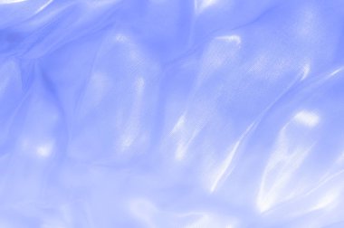 kumaş, arka plan doku. İpek mavi, bez. Zarif ve mükemmellik için dokulu, bir cömert'ipek tasarım parlayan mavi bölüm boyunca dalgası yaratıyor.