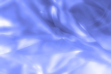 kumaş, arka plan doku. İpek mavi, bez. Zarif ve mükemmellik için dokulu, bir cömert'ipek tasarım parlayan mavi bölüm boyunca dalgası yaratıyor.