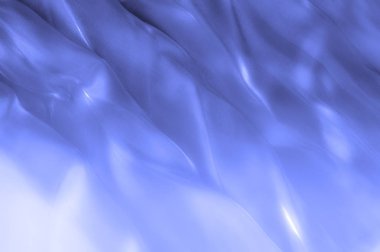 kumaş, arka plan doku. İpek mavi, bez. Zarif ve mükemmellik için dokulu, bir cömert'ipek tasarım parlayan mavi bölüm boyunca dalgası yaratıyor.