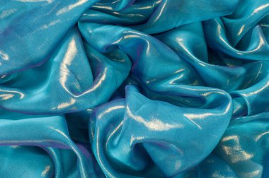 Doku, arka plan, desen. İpek kumaş mavi, ince havadar ipek kumaş, kumaş güneş ışınlarının yansıtır.