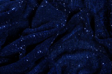  ile mavi kumaş. Göz alıcı bir ilişki için bu mavi maske spor. Dairesel çocuk sparkles yoğun bir düzenleme tüm kaplama için düz örgü gücü kapsamında kalır