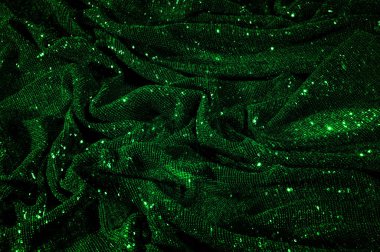 Doku, arka plan, desen, ile yeşil kumaş. Payetler payetler bu kumaş üzerine her açıdan göz kapmak üst üste gelen düz çizgiler içine dikilir ile bir açıklama yapmak.