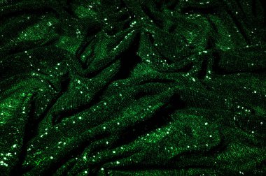 Doku, arka plan, desen, ile yeşil kumaş. Payetler payetler bu kumaş üzerine her açıdan göz kapmak üst üste gelen düz çizgiler içine dikilir ile bir açıklama yapmak.