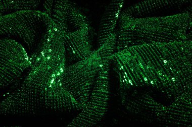 Doku, arka plan, desen, ile yeşil kumaş. Payetler payetler bu kumaş üzerine her açıdan göz kapmak üst üste gelen düz çizgiler içine dikilir ile bir açıklama yapmak.