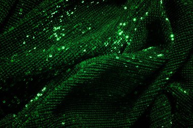 Doku, arka plan, desen, ile yeşil kumaş. Payetler payetler bu kumaş üzerine her açıdan göz kapmak üst üste gelen düz çizgiler içine dikilir ile bir açıklama yapmak.