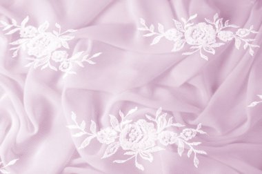 Doku, arka plan, desen. Dantelli beyaz kumaş. Çiçek dantel kumaştan yapılmış. Pembe ipek kumaş. tebrik kartı. Masaüstü duvar kağıdı. Tasarımcı için ekran koruyucu zemin