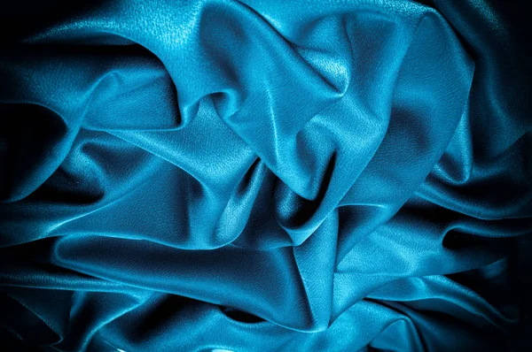 Doku, arka plan. şablon. İpek kumaş mavisi, mavi ipek kumaş ve avludaki döşeme kumaşı - koyu perdeler - sırt ve yastıklar için katı kumaşlar
