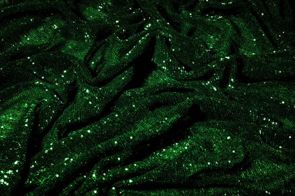 Doku, arka plan, desen, ile yeşil kumaş. Payetler payetler bu kumaş üzerine her açıdan göz kapmak üst üste gelen düz çizgiler içine dikilir ile bir açıklama yapmak.