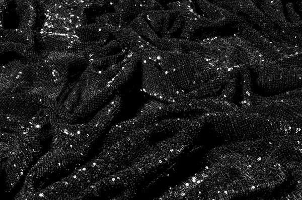 Black fabric with paillettes Make a dazzling debut  this Black Baby Sequined  The coating of the strength of the continuous mesh remains a dense arrangement of circular glitters for the entire coating