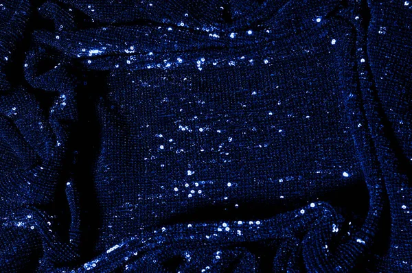  ile mavi kumaş. Göz alıcı bir ilişki için bu mavi maske spor. Dairesel çocuk sparkles yoğun bir düzenleme tüm kaplama için düz örgü gücü kapsamında kalır